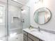 Updated bathroom featuring a glass shower, granite countertop and modern fixtures at 2405 Flints Pond Cir, Apex, NC 27523