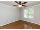 Bedroom with hardwood floors, lots of natural light and a ceiling fan at 2405 Flints Pond Cir, Apex, NC 27523