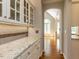 Butler pantry features granite counters, tiled backsplash, and access to main living space at 2405 Flints Pond Cir, Apex, NC 27523