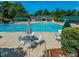 Community pool with lap lanes, lounge chairs, shade and tables at 2405 Flints Pond Cir, Apex, NC 27523