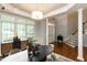 A staged dining room has wood floors, furniture and decor at 2405 Flints Pond Cir, Apex, NC 27523