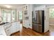 Modern kitchen includes stainless steel refrigerator, granite countertops, and storage at 2405 Flints Pond Circle Cir, Apex, NC 27523