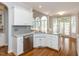 Open kitchen design features granite counters, stainless appliances, and eat-in space at 2405 Flints Pond Cir, Apex, NC 27523