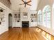 Spacious living room has fireplace, arched windows, and beautiful natural light at 2405 Flints Pond Cir, Apex, NC 27523