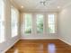 Bright living room with hardwood floors, lots of windows and a ceiling fan at 2405 Flints Pond Cir, Apex, NC 27523