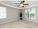 Spacious main bedroom with a ceiling fan, tray ceilings and lots of natural light at 2405 Flints Pond Cir, Apex, NC 27523