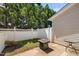 Small backyard with a concrete patio, fire pit and a white wooden fence at 2609 Asher View Ct, Raleigh, NC 27606