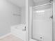 Bathroom featuring a bathtub, walk-in shower, and neutral finishes at 2609 Asher View Ct, Raleigh, NC 27606
