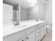 Bathroom featuring dual sinks, a large mirror, and white cabinetry at 2609 Asher View Ct, Raleigh, NC 27606