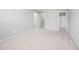 Neutral bedroom featuring a walk-in closet and attached bathroom with natural light at 2609 Asher View Ct, Raleigh, NC 27606