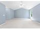 Spacious bedroom with neutral carpet, vaulted ceiling, and natural light at 2609 Asher View Ct, Raleigh, NC 27606