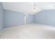Bright bedroom features neutral carpet, vaulted ceiling, and spacious floorplan at 2609 Asher View Ct, Raleigh, NC 27606