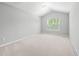 Bedroom features a large window, neutral carpet, and ample space at 2609 Asher View Ct, Raleigh, NC 27606