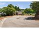 Community clubhouse featuring ample parking surrounded by mature trees at 2609 Asher View Ct, Raleigh, NC 27606