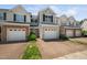 Lovely townhome featuring a one-car garage, landscaped front yard, stone accents and a cozy, inviting entrance at 2609 Asher View Ct, Raleigh, NC 27606
