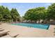 Large community pool with lounge chairs and mature trees at 2609 Asher View Ct, Raleigh, NC 27606