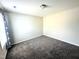This empty bedroom is carpeted and has white walls and one window at 267 Darecrest Ln, Wendell, NC 27591