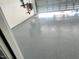 Spacious garage with epoxy floor finish, ideal for car care or hobby projects at 267 Darecrest Ln, Wendell, NC 27591