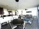 Bright living room and kitchen featuring an open layout, modern decor, and hardwood floors for seamless living at 267 Darecrest Ln, Wendell, NC 27591