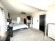Spacious main bedroom featuring neutral walls, carpeted floors, a ceiling fan, and two walk-in closets for ample storage at 267 Darecrest Ln, Wendell, NC 27591