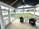 Relaxing screened porch with furniture overlooking the backyard at 267 Darecrest Ln, Wendell, NC 27591