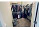 Spacious walk-in closet with double hanging rods and ample storage space, and room for a laundry basket on the floor at 267 Darecrest Ln, Wendell, NC 27591