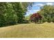 Expansive backyard showcasing lush greenery, perfect for outdoor activities and relaxation at 2913 Escondido Farm Rd, Garner, NC 27529