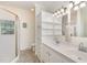 Bright bathroom with dual sinks, custom cabinetry, and a walk-in shower at 2913 Escondido Farm Rd, Garner, NC 27529