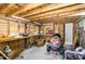 Well-lit garage interior features wood walls, plenty of shelf and workbench space, perfect for projects at 2913 Escondido Farm Rd, Garner, NC 27529