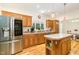 Well-equipped kitchen featuring stainless steel appliances, a central island, and ample counter space at 2913 Escondido Farm Rd, Garner, NC 27529