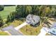 Aerial view of a well-maintained two-story home, showcasing its expansive lot with manicured lawn and driveway at 300 Scotland Dr, Youngsville, NC 27596