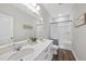 Bathroom featuring double sink vanity and a shower and bathtub combination at 300 Scotland Dr, Youngsville, NC 27596