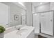 Bathroom features a glass enclosed shower, a white vanity, and neutral paint at 300 Scotland Dr, Youngsville, NC 27596