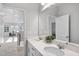 Bathroom with double sink vanity, large mirror and views to the work out room at 300 Scotland Dr, Youngsville, NC 27596