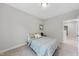 Bedroom features neutral walls, carpet flooring, and a full-size bed at 300 Scotland Dr, Youngsville, NC 27596
