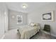 Bedroom features neutral walls, carpet flooring, and a full-size bed at 300 Scotland Dr, Youngsville, NC 27596