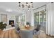 Charming dining area with round table, stylish seating, and access to an outdoor patio at 300 Scotland Dr, Youngsville, NC 27596