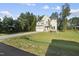 Well-manicured lawn and long driveway leading to this charming two-story home at 300 Scotland Dr, Youngsville, NC 27596