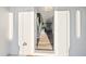 Inviting foyer with wood flooring and a staircase, filled with natural light at 300 Scotland Dr, Youngsville, NC 27596