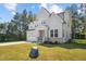 A two-story home with a stone-accented facade, a two-car garage, and well-maintained landscaping at 300 Scotland Dr, Youngsville, NC 27596