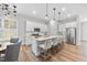 Well-lit kitchen boasting an island, stainless steel appliances, and a breakfast area at 300 Scotland Dr, Youngsville, NC 27596