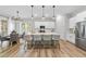 Stylish kitchen with island seating, stainless steel appliances, and an adjacent breakfast nook at 300 Scotland Dr, Youngsville, NC 27596
