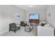 Cozy living room with a TV, comfortable seating, and bright lighting at 300 Scotland Dr, Youngsville, NC 27596