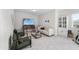Cozy living room with a TV, comfortable seating, and bright lighting at 300 Scotland Dr, Youngsville, NC 27596