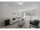 Spacious living room with comfortable seating, a cabinet, and bright lighting at 300 Scotland Dr, Youngsville, NC 27596