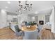 Open-concept living space with kitchen, dining area, and fireplace, perfect for entertaining at 300 Scotland Dr, Youngsville, NC 27596