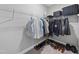 Organized walk-in closet with extensive shelving, clothing racks, and ample storage space for shoes at 300 Scotland Dr, Youngsville, NC 27596