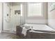 Modern bathroom with glass-enclosed shower, soaking tub, and stylish gray tile for a sleek, clean aesthetic at 30150 Walser, Chapel Hill, NC 27517