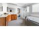 Elegant bathroom features double sinks, a soaking tub with shower and wood cabinets for ample storage at 30150 Walser, Chapel Hill, NC 27517