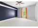 Inviting bedroom with neutral carpeting, and a large window offering natural light and views at 30150 Walser, Chapel Hill, NC 27517